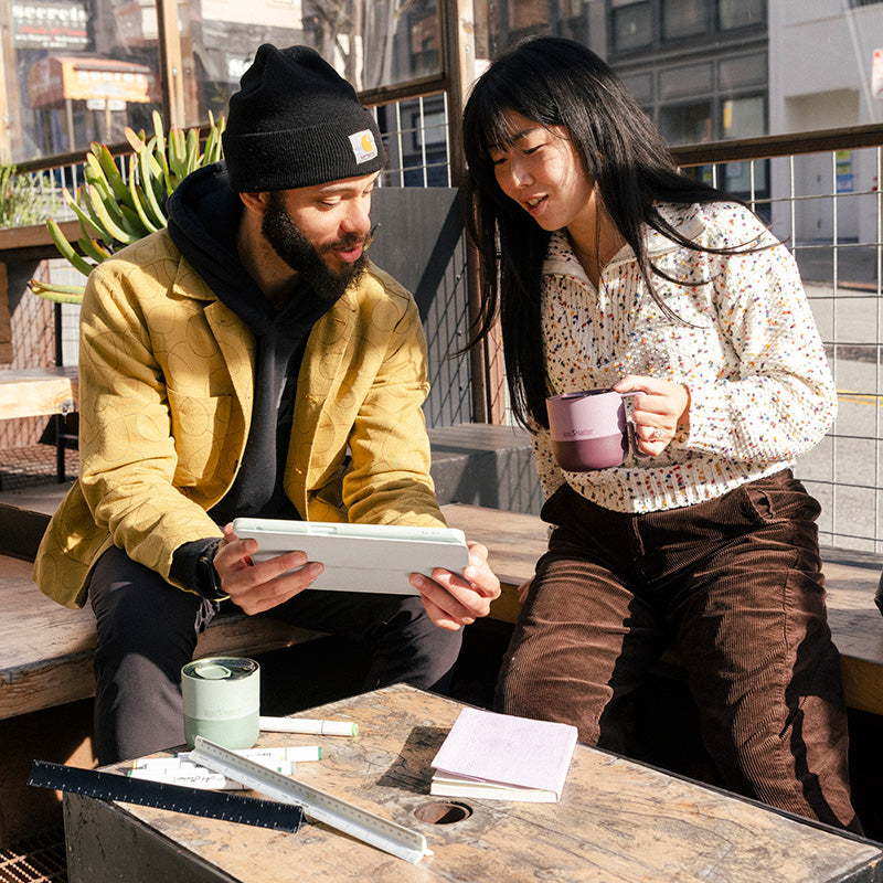 12oz-rise-mug-j1 12oz_rise_coffee_mug_dusty_orchid_couple_city_patio_square.jpg