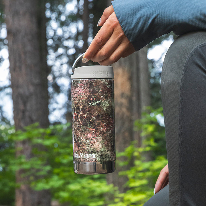 12oz-tkwide-with-twist-cap-mossy-oak-y4 12oz_tumbler_mossyoak_rainbowtrout_hand_closeup_square.jpg