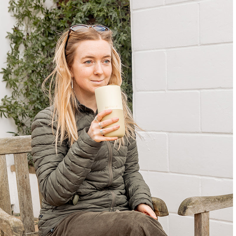 16oz-rise-tumbler-s8 16oz_rise_tumbler_wax_yellow_woman_seat_outside_square.jpg