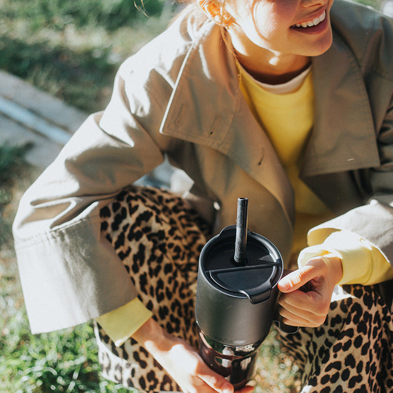 26oz-rise-tumbler-with-straw-lid-w1 26oz_rise_tumbler_black_woman_topview_square.jpg